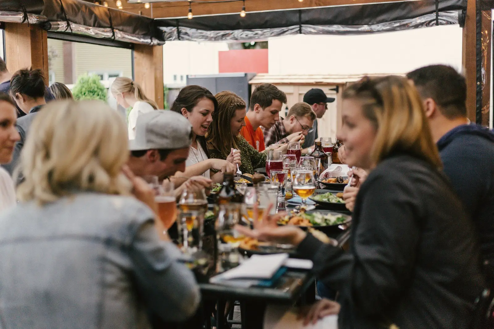 Guests sharing a long dinner table