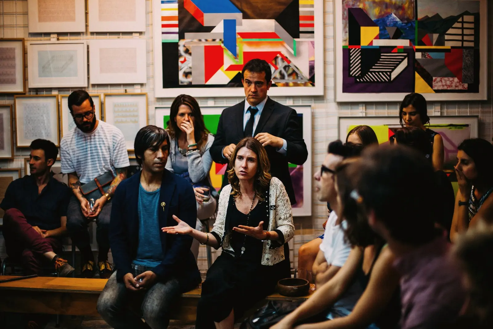 Casual panel conversation with an audience in a gallery space