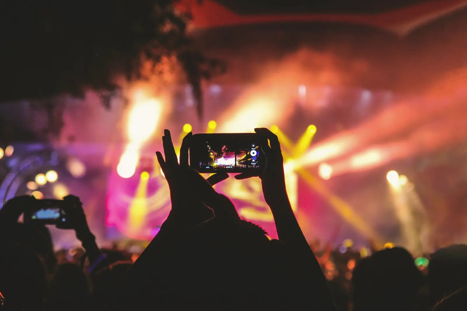 Guests filming the stage on their phones